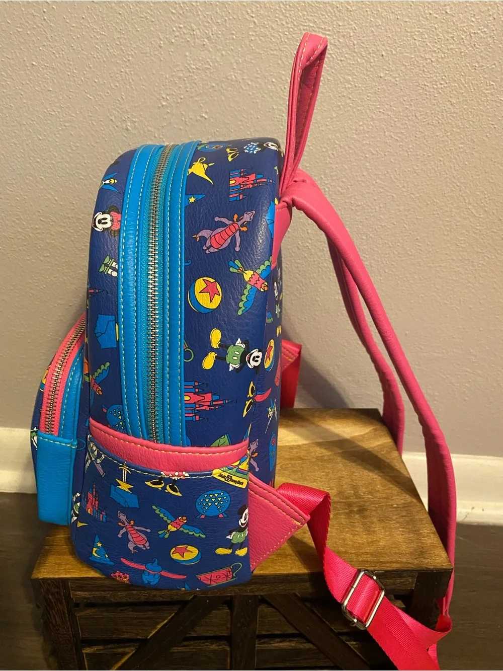 Loungefly Blue Mini Backpack with Pink Trim and Multicolor Disney Icons